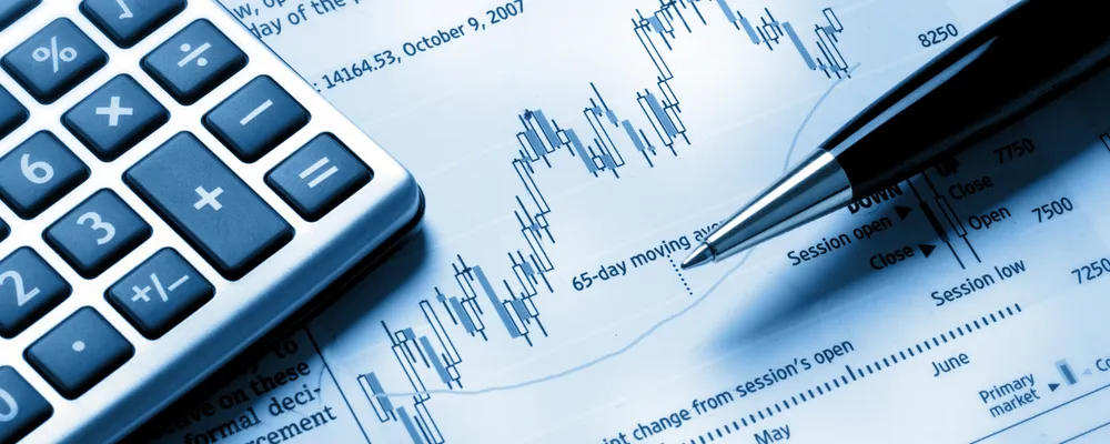 A pen and calculator representing financial risk and assessment.